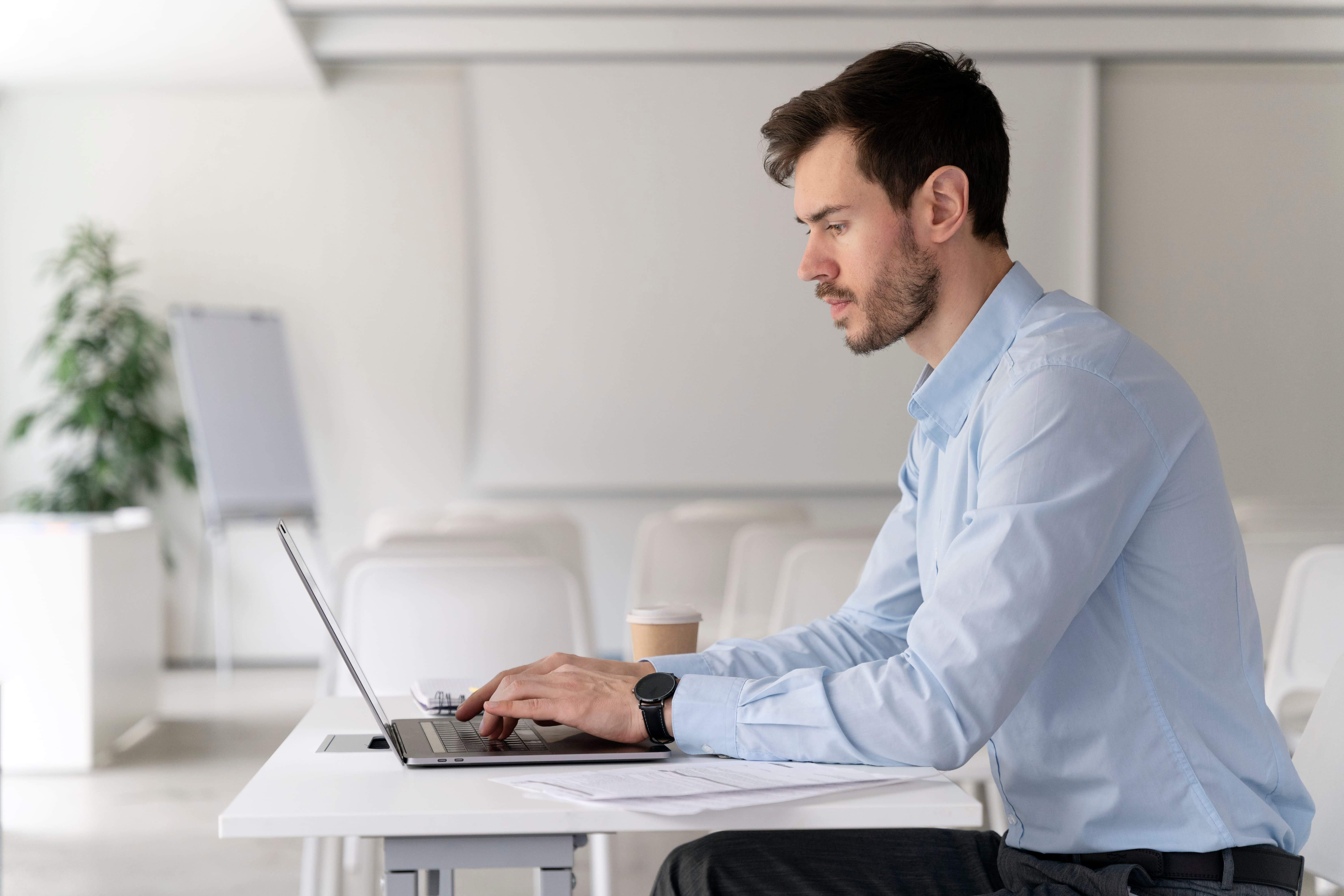 Young Business Man Working Her Desk With Laptop